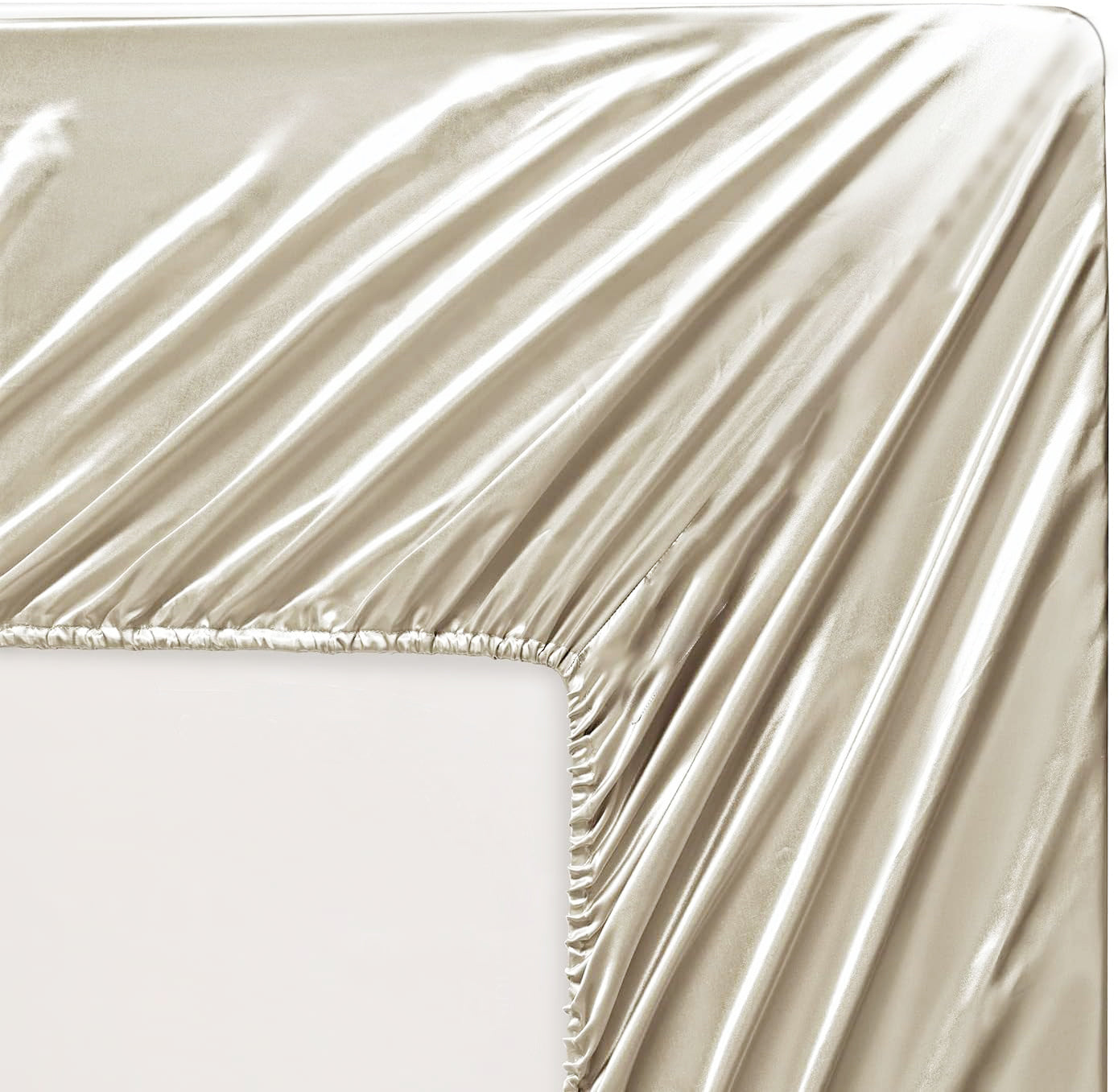 Satin fitted sheet in light gold on mattress