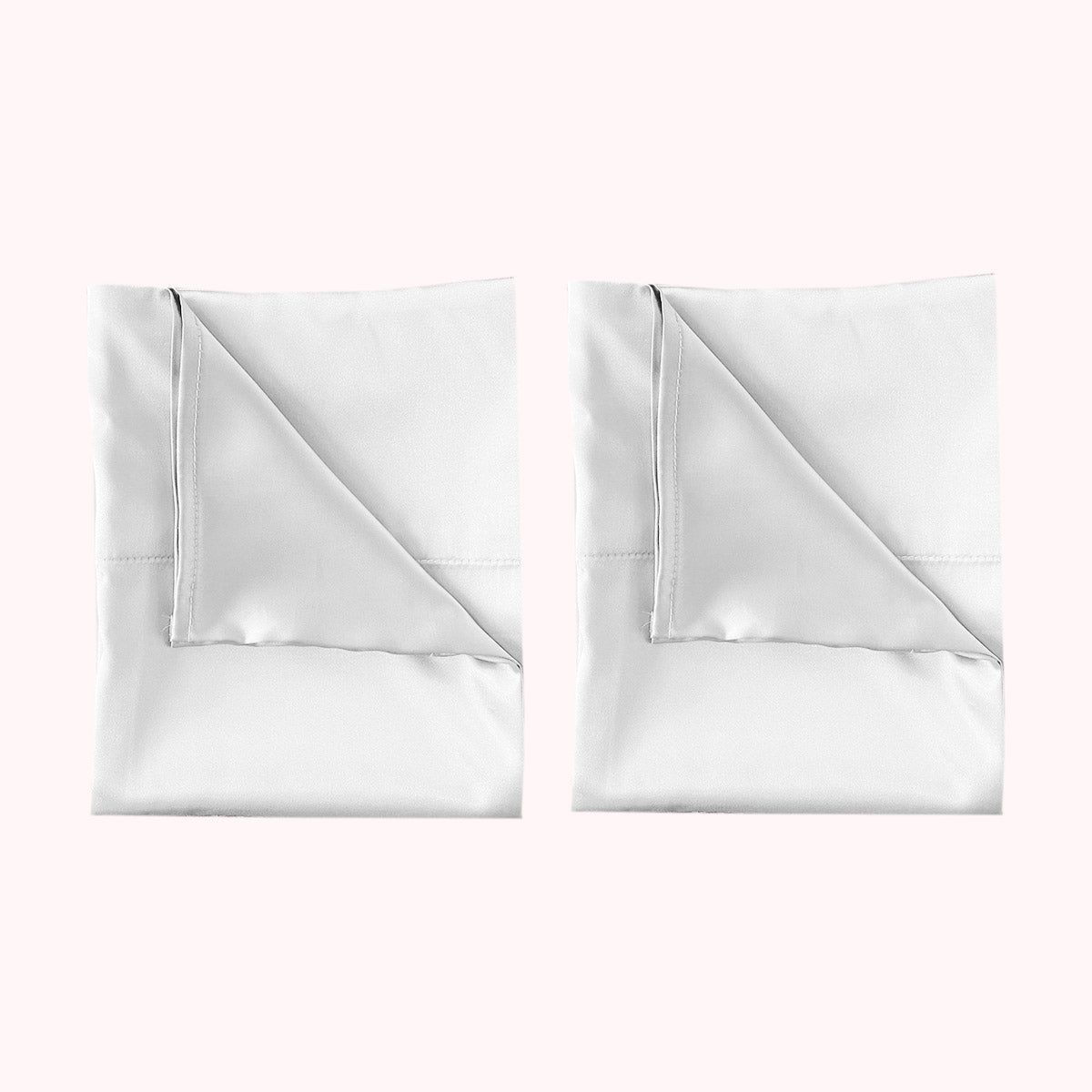 2 folded satin pillowcases in white