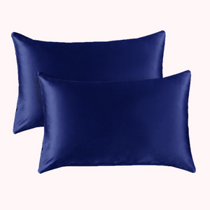 2 pillows encased in navy blue satin pillowcases