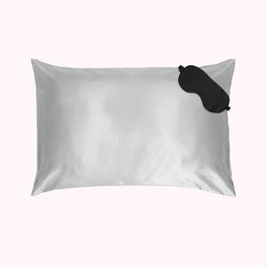 1 pillow encased in silver silk pillowcase with black eyemask